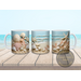  Coastal drinkware on a beach-themed kitchen counter.